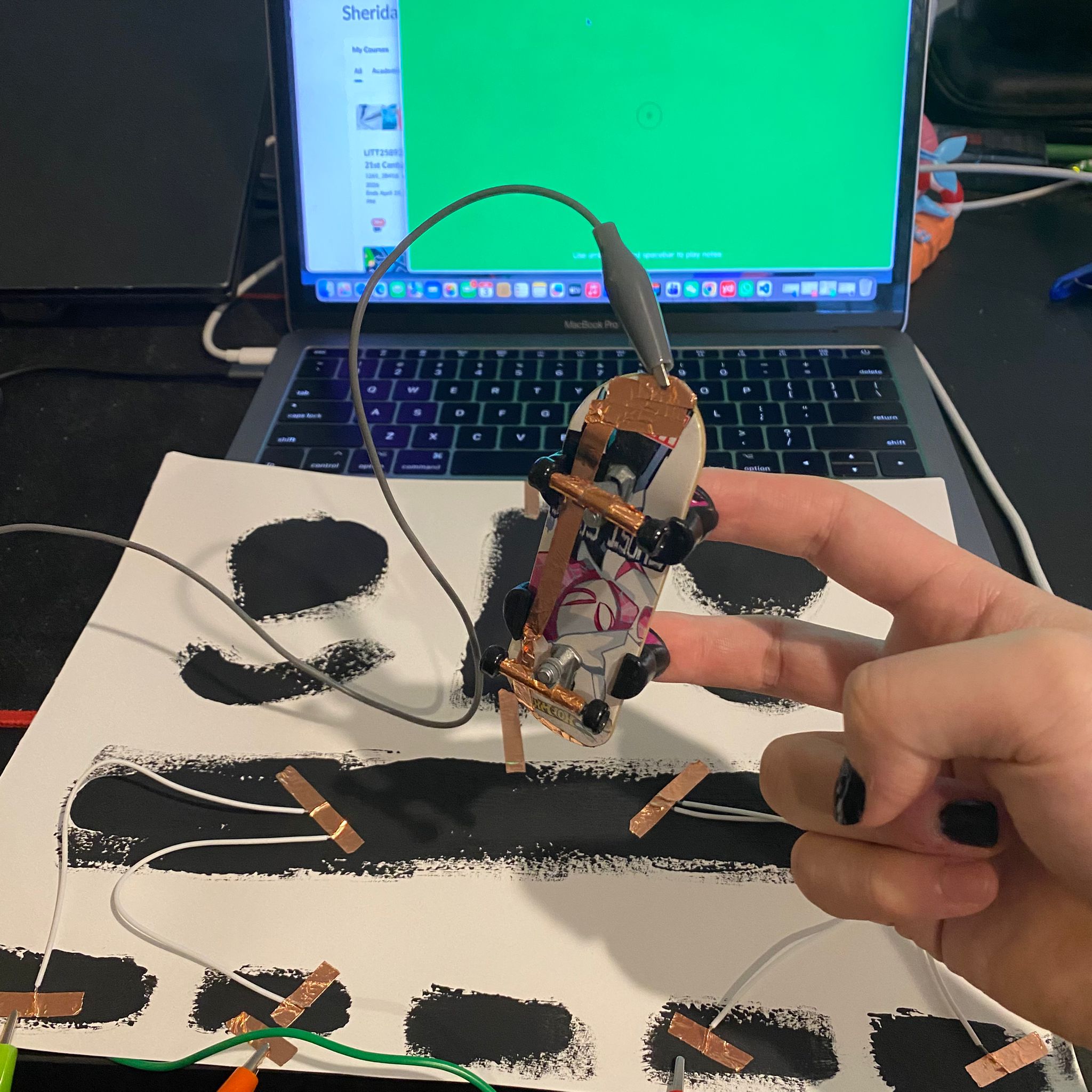 I connected the fingerboard to the wire and attempted to interact with the conductive paint.