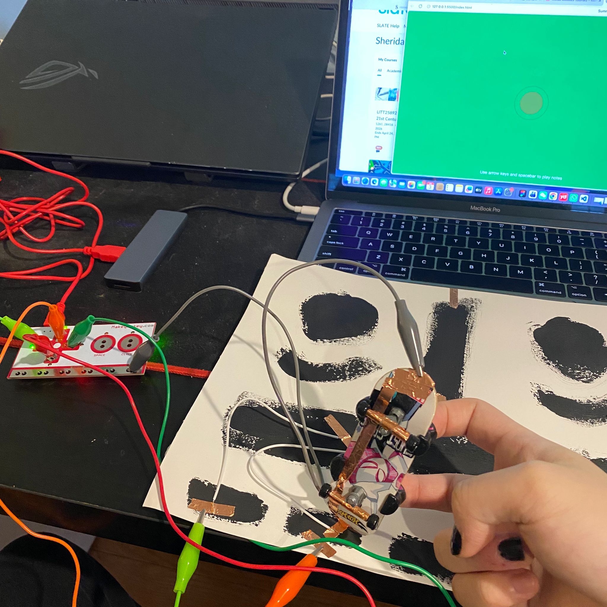 I attempted to touch different sections of the conductive paint to observe the changes.