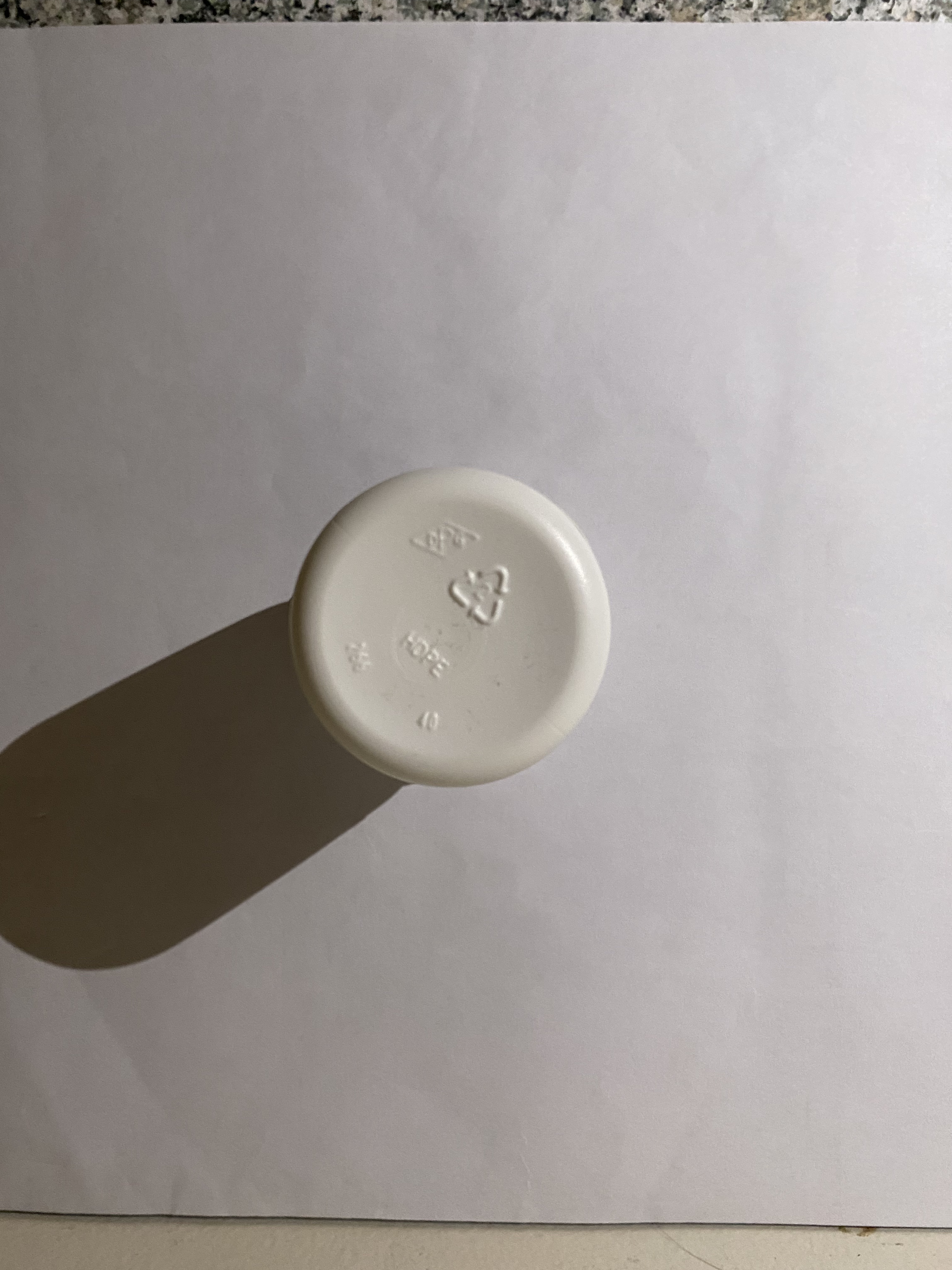 The bottom view of the medicine bottle